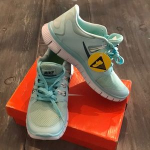 Nike Free 5.0, New in Box. Soft teal/blue color.